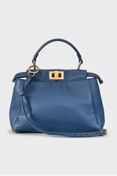 Blue leather bag with gold hardware