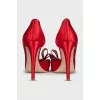 Red textile shoes with a bow