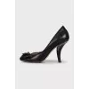 Black high heels with a bow
