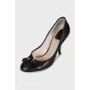 Black high heels with a bow