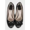 Black high heels with a bow