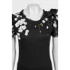 A straight T-shirt decorated with crystals and sequins