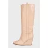 Beige leather wedge boots