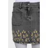 Denim mini skirt with a ripped effect