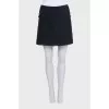 Mini skirt decorated with chains