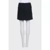 Mini skirt decorated with chains