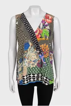 Sleeveless silk blouse with tag