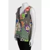 Sleeveless silk blouse with tag