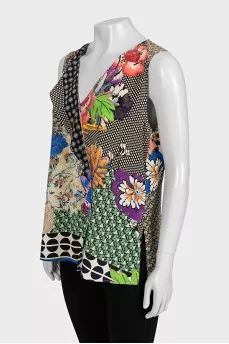 Sleeveless silk blouse with tag