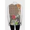 Sleeveless silk blouse with tag