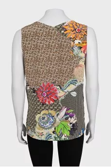 Sleeveless silk blouse with tag