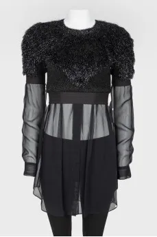 Black top with a decorative pile with a transparent bottom