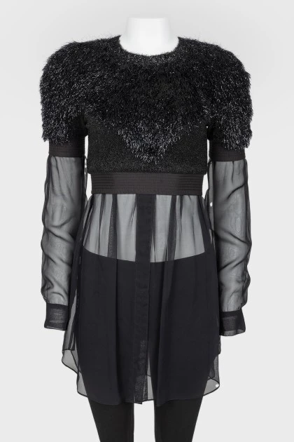 Black top with a decorative pile with a transparent bottom
