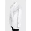Loose-fitting blouse with perforations