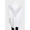 Loose-fitting blouse with perforations