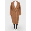 Brown coat of camel wool on buttons
