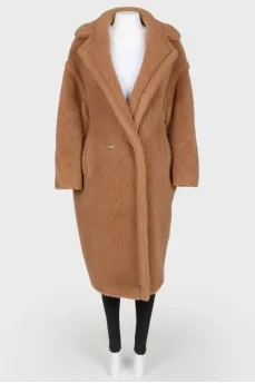 Brown coat of camel wool on buttons