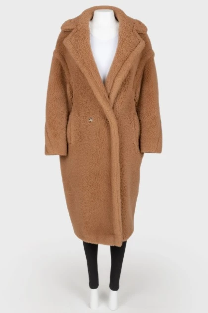 Brown coat of camel wool on buttons