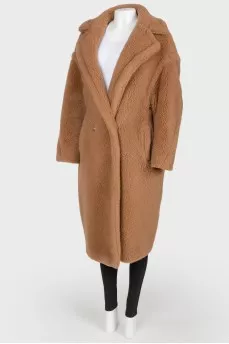 Brown coat of camel wool on buttons