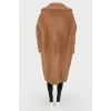 Brown coat of camel wool on buttons