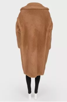 Brown coat of camel wool on buttons