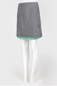 Gray woolen skirt on a green lining
