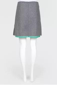 Gray woolen skirt on a green lining