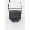 Leather curly bag with a metal handle