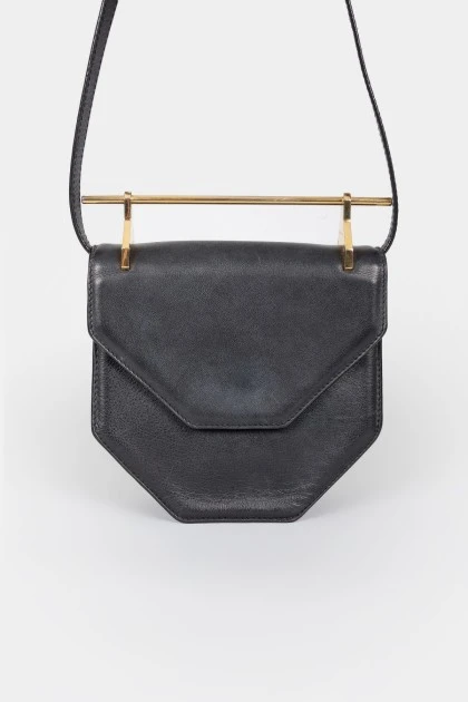 Leather curly bag with a metal handle