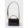 Little leather black handbag with tag