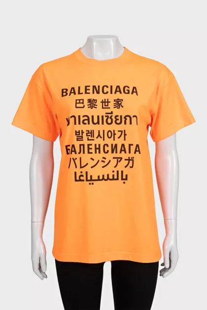 Bright orange T-shirt with a signature print
