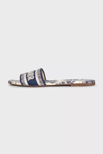 Blue flip-flops with a signature print