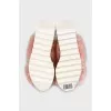 Pink flip flops with embellished platform