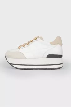 White leather sneakers on a high platform