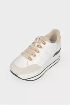 White leather sneakers on a high platform
