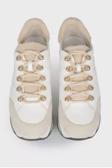 White leather sneakers on a high platform