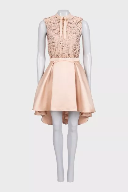 Beige dress with a decorated top
