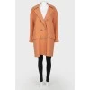 Woolen brown coat on golden buttons