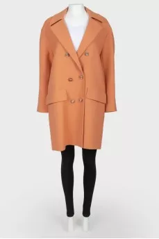 Woolen brown coat on golden buttons