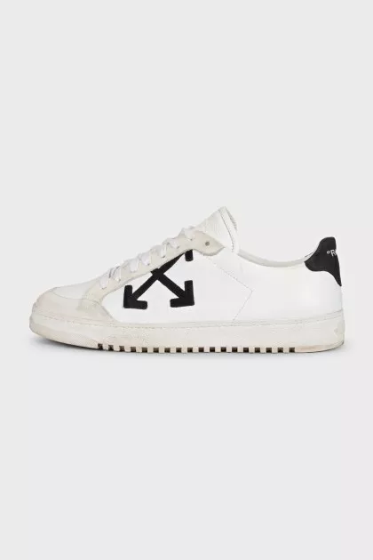White leather sneakers with black heels