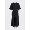 Black straight dress with pleated hem