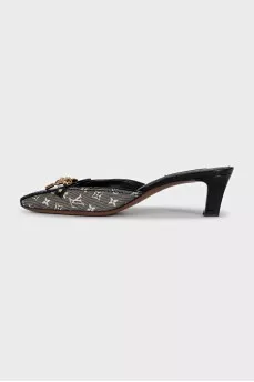 Black mules with metallic decor