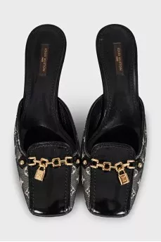 Black mules with metallic decor