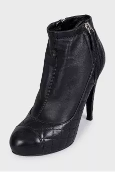 Black quilted ankle boots with logo