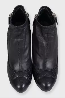 Black quilted ankle boots with logo