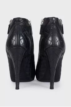 Black quilted ankle boots with logo