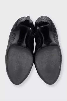 Black quilted ankle boots with logo