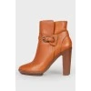 Red buckle ankle boots