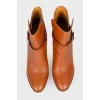 Red buckle ankle boots