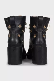 Leather ankle boots with gold embroidery